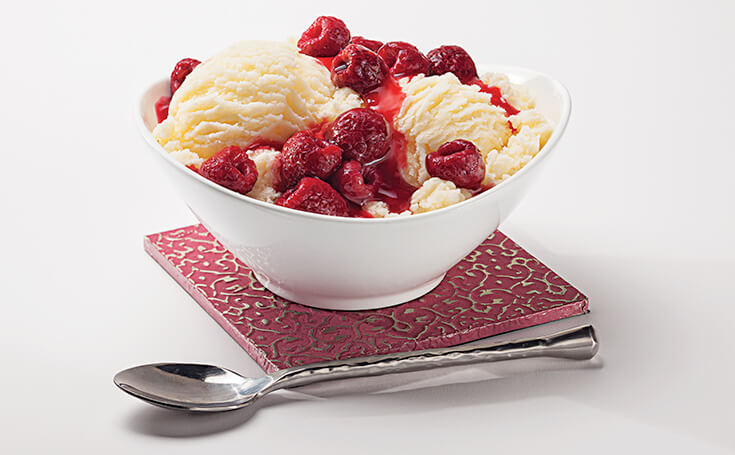 Raspberries on Ice Cream Image